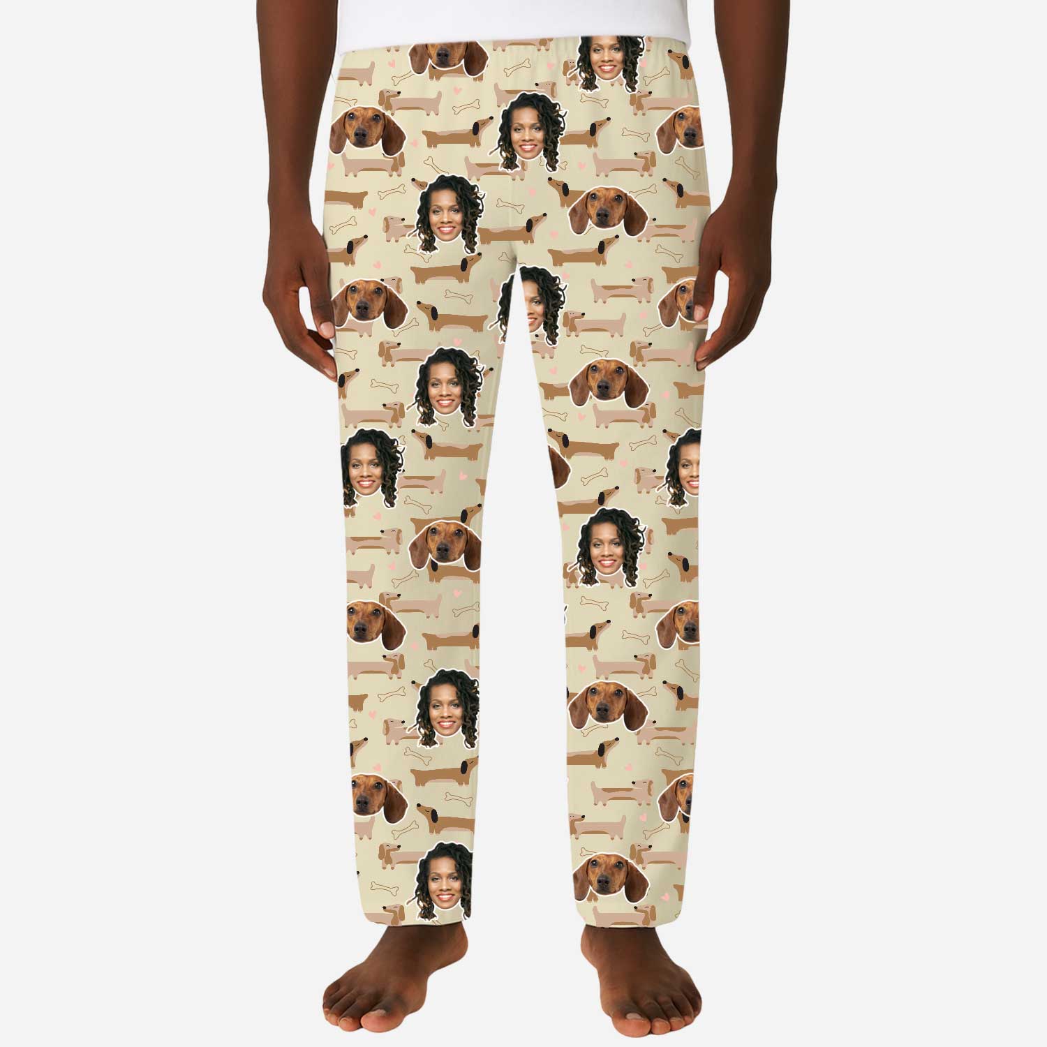 Pajama pants with a pattern of a person and dogs on a beige background