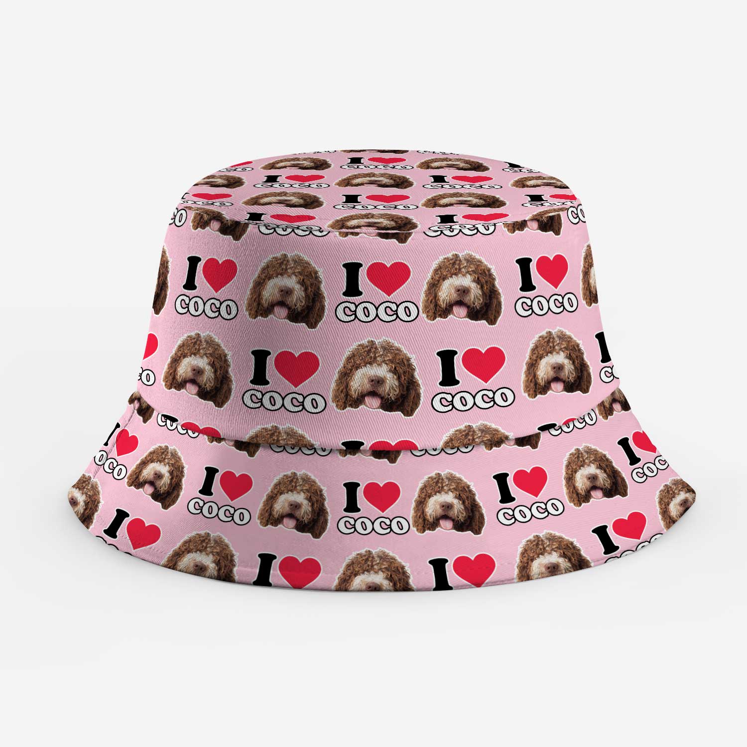 Pink bucket hat with dog pattern and text on a white background
