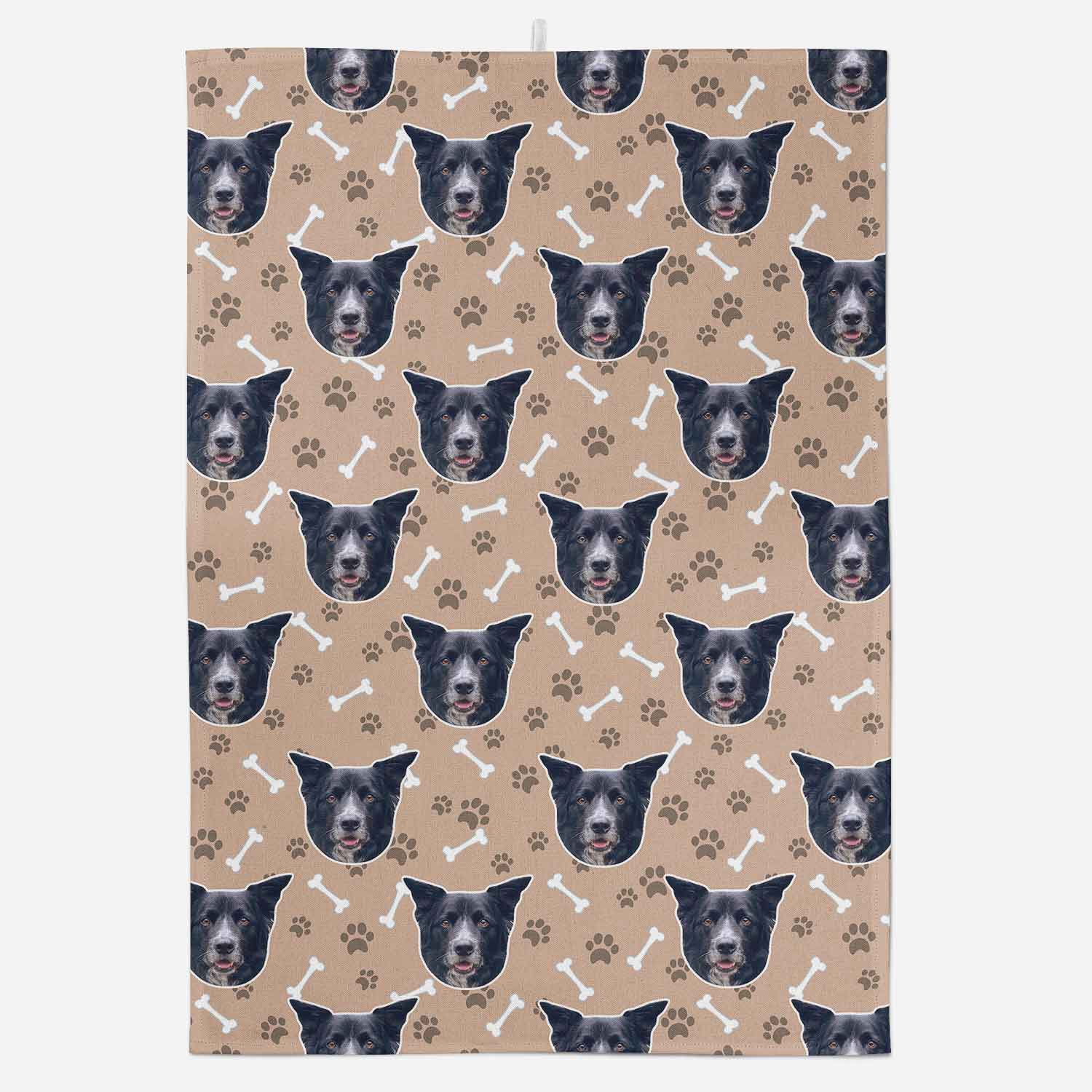 Patterned towel with dog faces and bones on a beige background