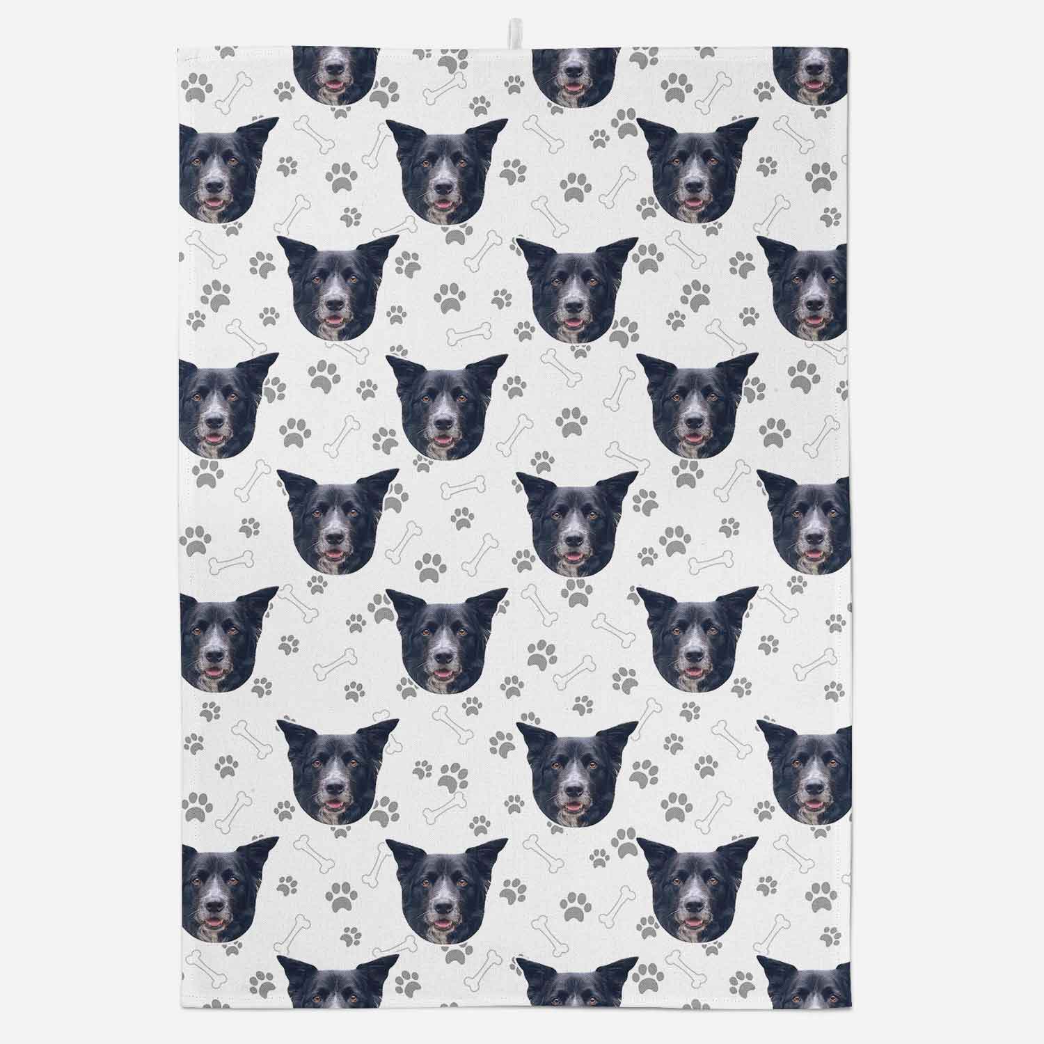 Patterned towel with repeated dog face design on a white background