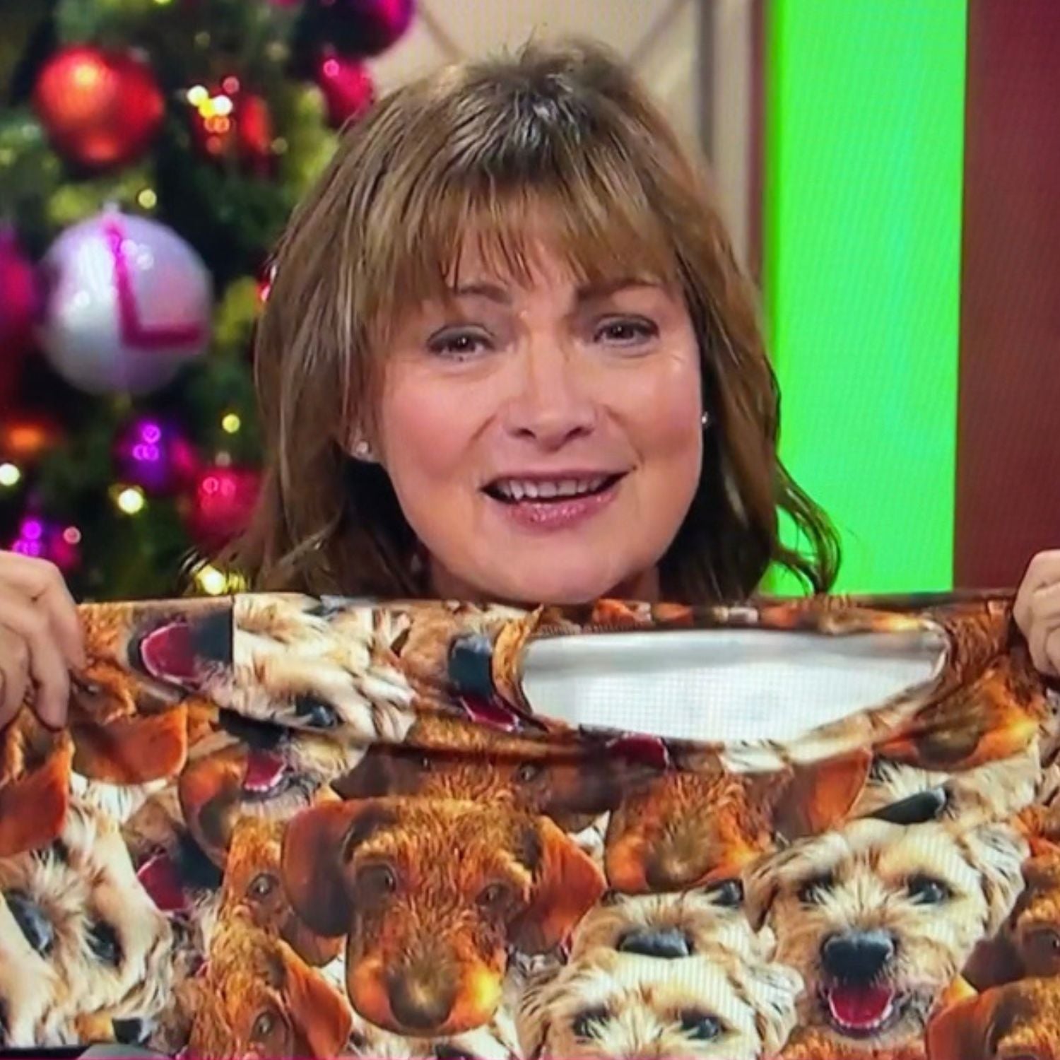 lorraine from itv holding her personalized dog pajamas up