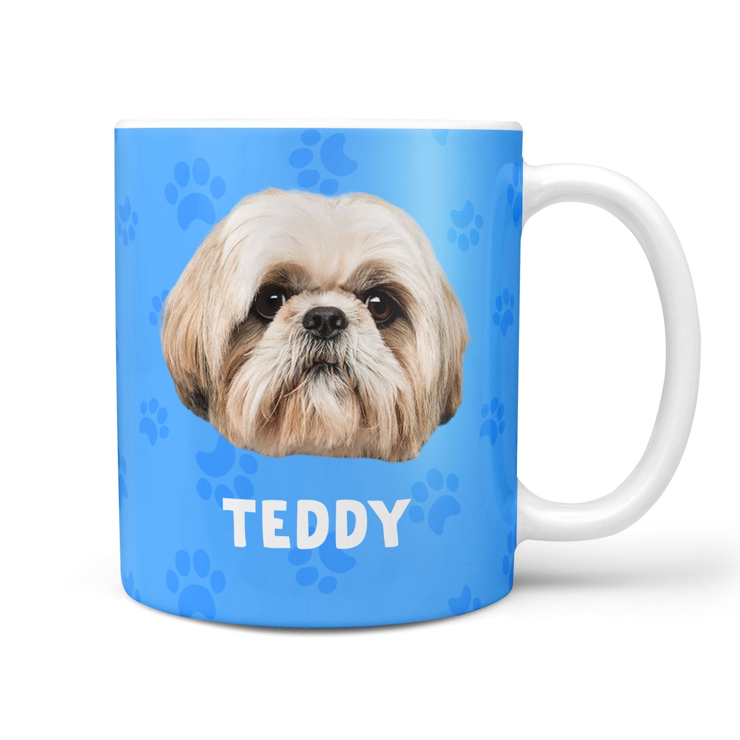 Mug with a dog's face and name 'Teddy' on a blue background with paw prints