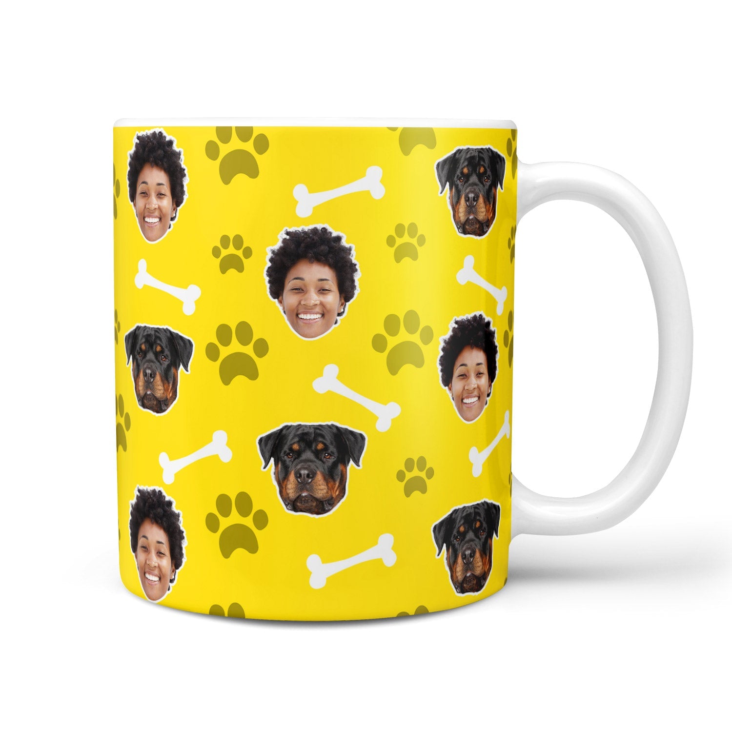 Mug with yellow background featuring dog faces and paw prints, on a white background